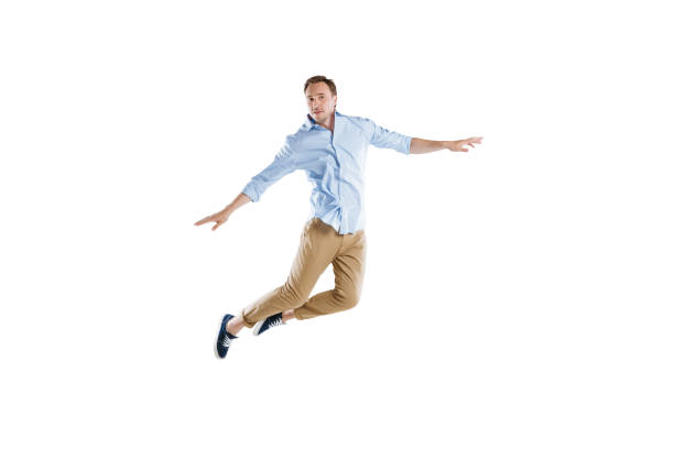 istock young casual man jumping with arms outstretched isolated on white 805271222