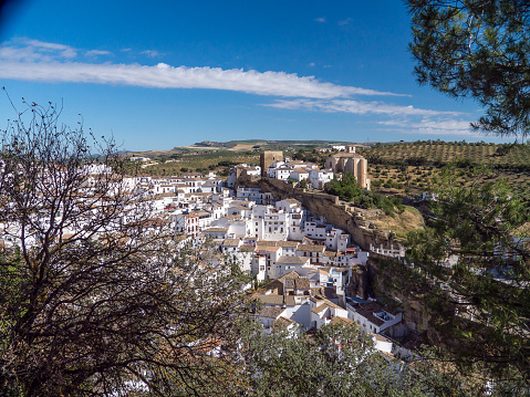 Ronda and Puente Viejo (Old Bridge) . Aerial view of houses and cathedral in Ronda, Andalusia, Spain