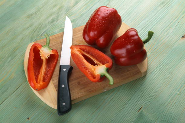 istock Red pepper on the wooden table. 805291078
