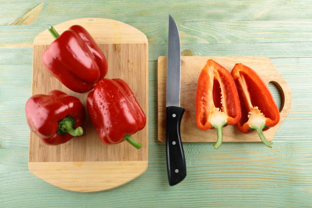 istock Red pepper on the wooden table. 805291110