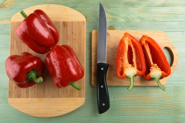 istock Red pepper on the wooden table. 805291112