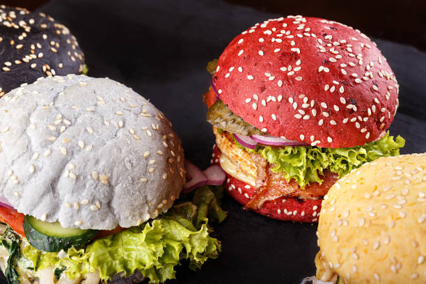 lot of hamburgers based on different color buns