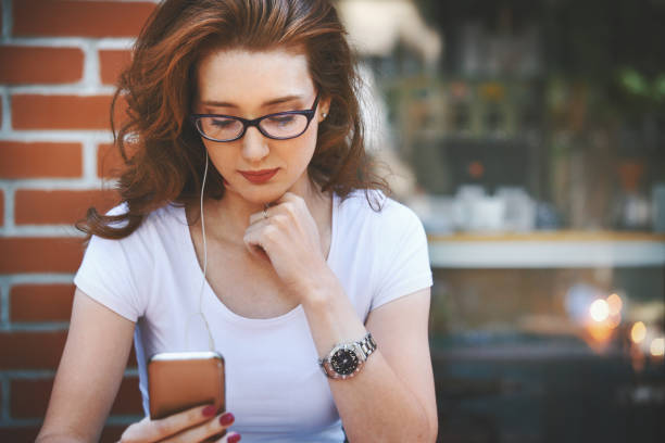 istock Woman listening to a podcast. 805304768