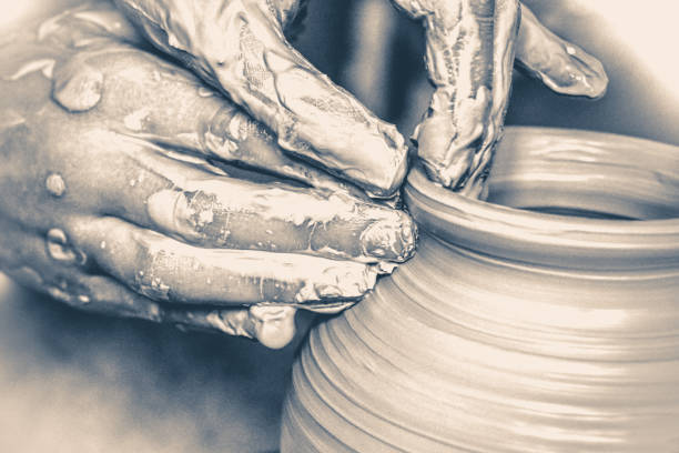 istock Old vinage style. Hands in the clay macro 805306850