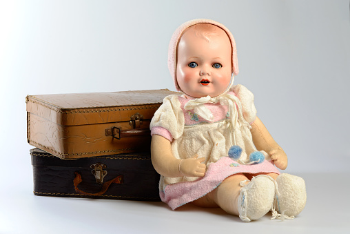 Vintage puppet, blond woman in front of a yellow heart shape background