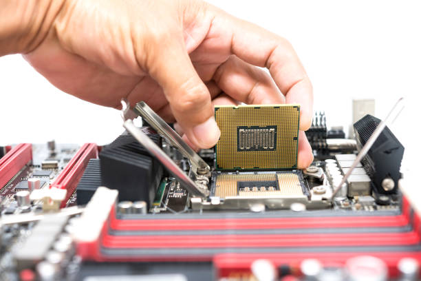 istock Hand holding CPU show  the ic surface and have motherboard open socket mount for cpu isolated on white bakcground 805346358