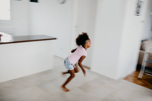istock Beautiful girl running troug apartment. Motion blur 805367752