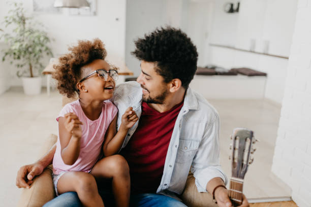 istock A happy father and daughter playing together at home 805368996