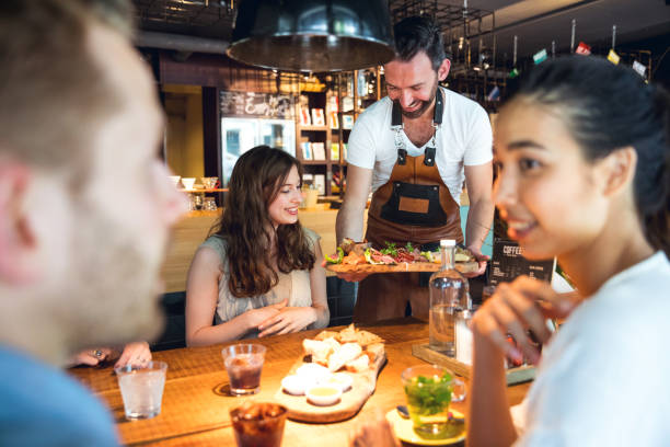 istock Friends celebrating a party in a cafe 805378860