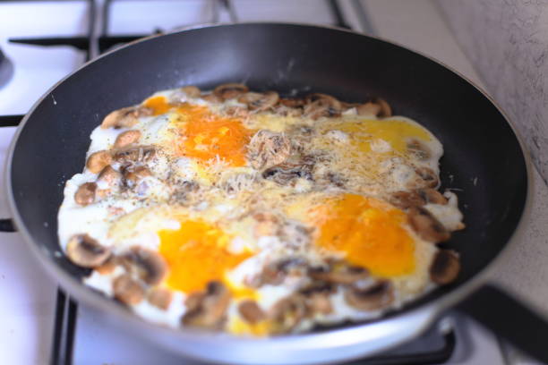 istock Fried egg with cheese. A healthy breakfast in the pan. 805381978