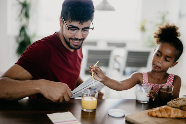 istock Cute child goofying around at the breakfast 805388622