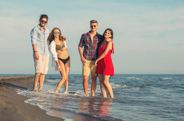 istock Group of friends together on the beach having fun. 805392944