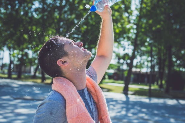 istock Young man wash face after running 805408050
