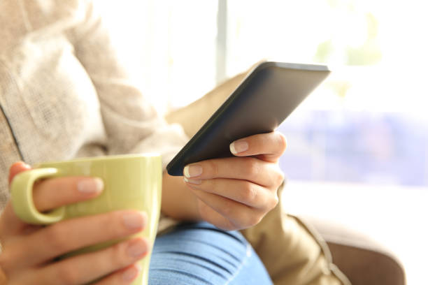 istock Relaxed girl checking mobile phone at home 805415794