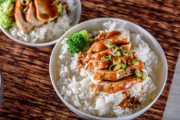 istock Grilled Chicken Breast with Teriyaki Sauce over Steamed Rice 805425746