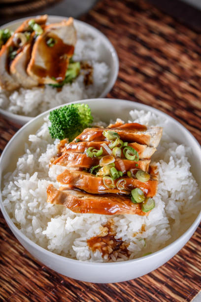 istock Grilled Chicken Breast with Teriyaki Sauce over Steamed Rice 805427554