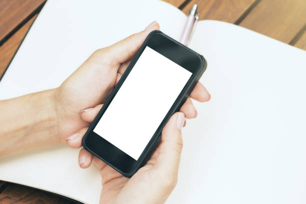 istock Woman holding cellphone 805431438
