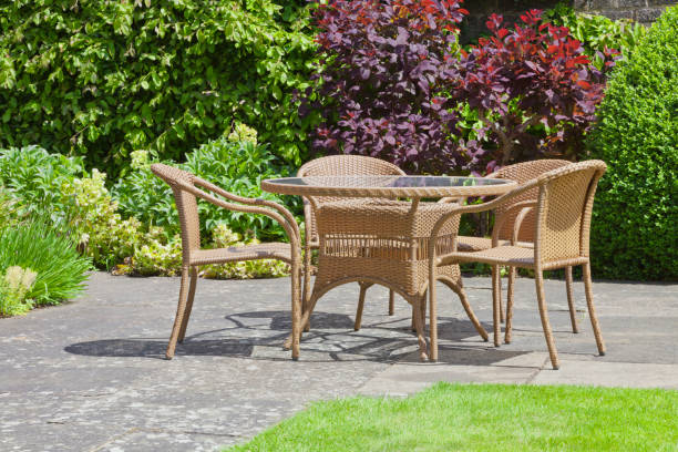 istock Garden dining chairs and table in a small patio 805433910