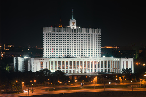 Aerial view of the illuminated Russian White House - House of the Government of the Russian Federation at Night, Moscow, Russia