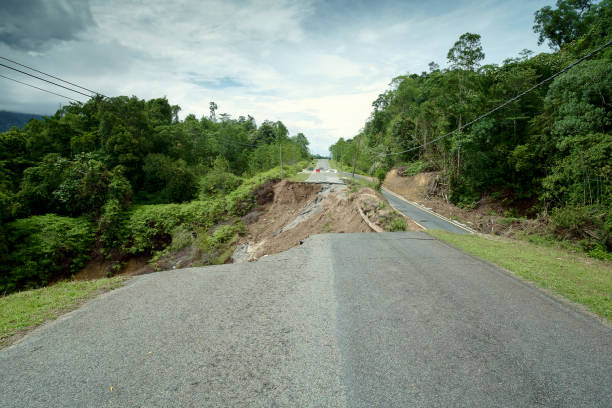 istock Asphalt Cracked Road Collapsed by Landslide 805463512