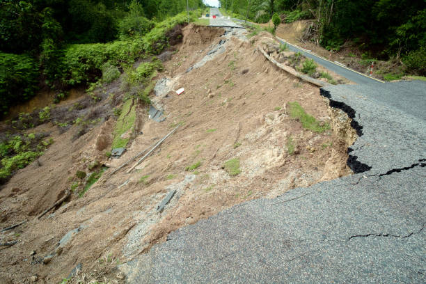 istock Asphalt Cracked Road Collapsed by Landslide 805467936