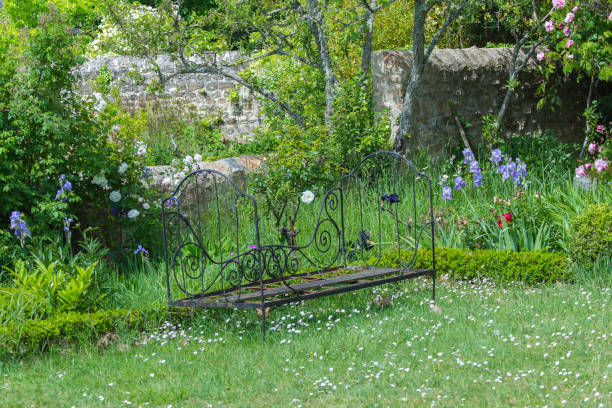istock Old bench in a french garden 805479682