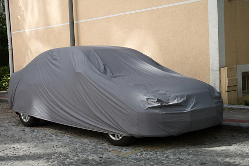 Car covered with textile cover
