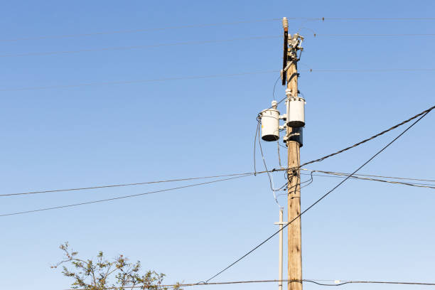 istock Electricity and utility pole and power lines 805544664