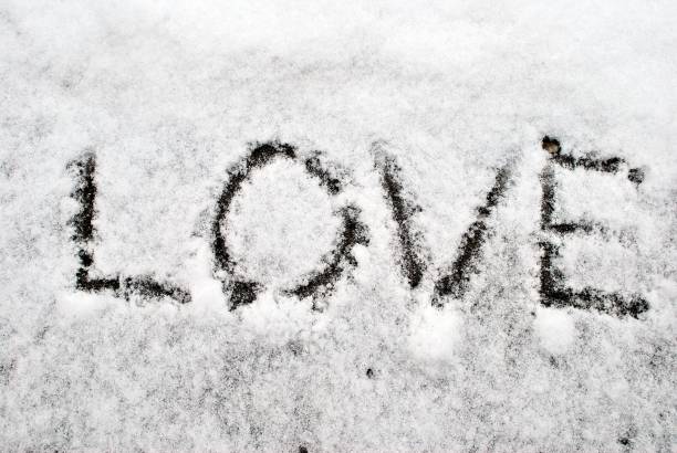 istock Written word LOVE on a snow. 805549734