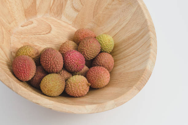 lychee fruit in a bowl stock photo