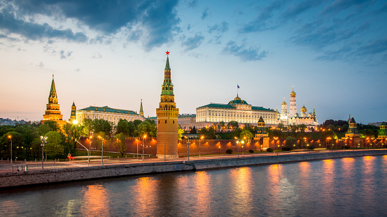 Beautiful illuminated famous waterfront panorama of the Kremlin in Moscow at Twilight - Night. The official residence of the president of the Russian Federation. Moscow, Russia.
