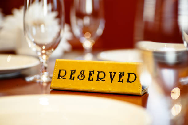 istock A sign on the reserved table in the restaurant. 805610456