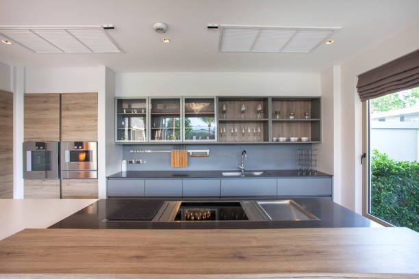 istock luxury interior design pool villa in kitchen area which feature island counter and built in furniture 805650928