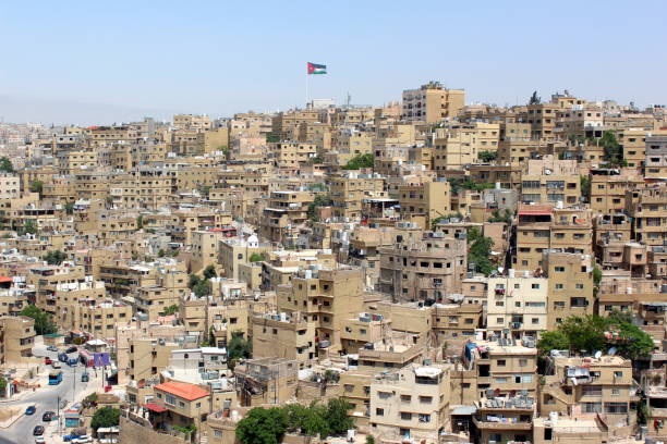 istock Amman city view with big Jordan flag, Amman 805651864