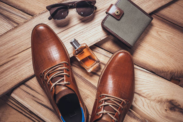 Men's accessories organized on wooden table Men's accessories organized on wooden table belongings photos stock pictures, royalty-free photos & images