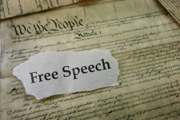 Freedon of Speech Free Speech newspaper headline on a copy of the United States Constitution censorship photos stock pictures, royalty-free photos & images