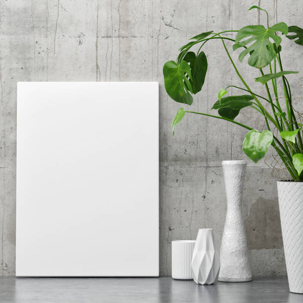 istock White poster on concrete wall, minimalism decor with plant 805666892