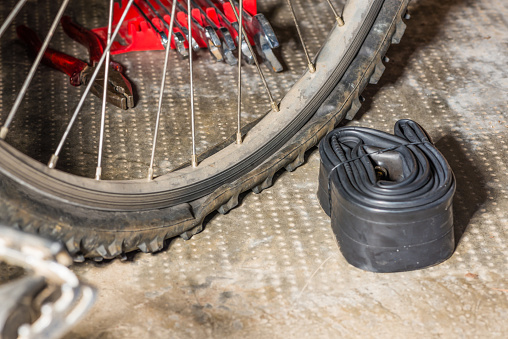 Flat tire on bicycle. Bike maintenance, repair and cycling concept. stock photo