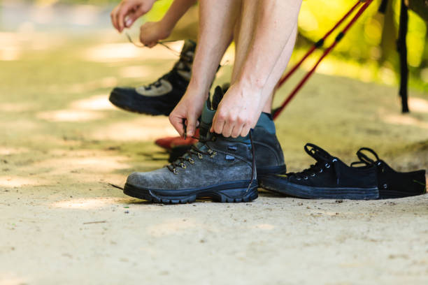istock Hikers preparing their footwear. 805681494