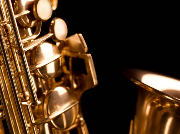istock Golden saxophone on dark background. 805682048