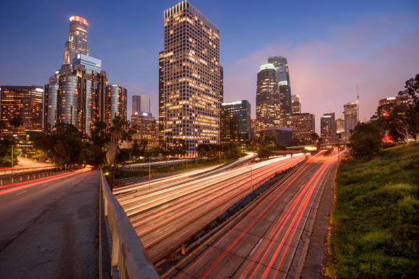 istock Downtown Los Angeles at night with car traffic light trails 805689414