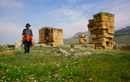 A traveler sits at the Ephesus Theater, Turkey