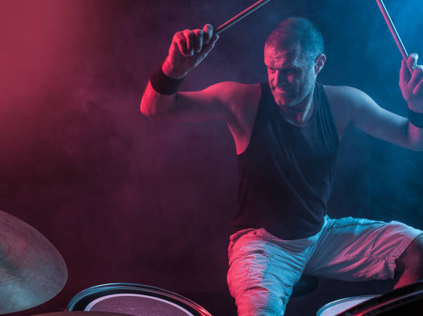 istock Rock N Roll Drummer With Arms Raised 805750390
