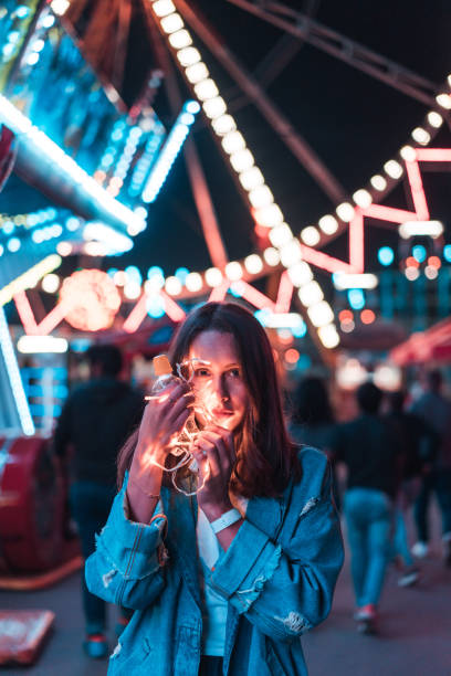 istock Girl in an amusement park 805760558