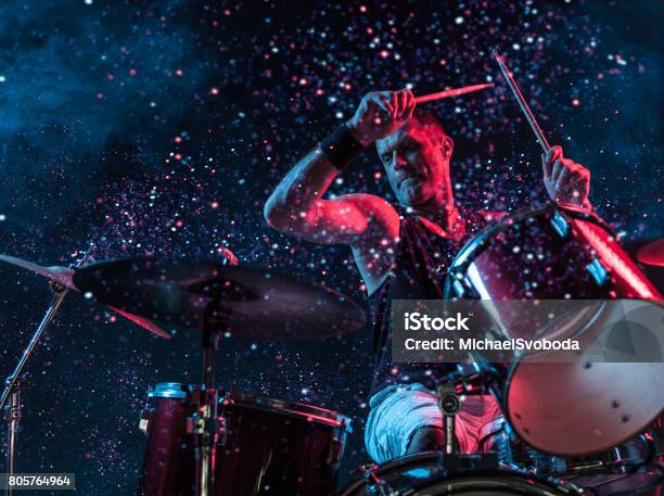 Rock N Roll Drummer Sparkles In The Air Stock Photo - Download Image Now - Rock Music, Drummer, Drum - Percussion Instrument