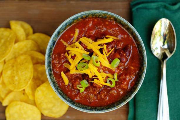 istock Bowl of Chili with Chips and Garnish 805809444
