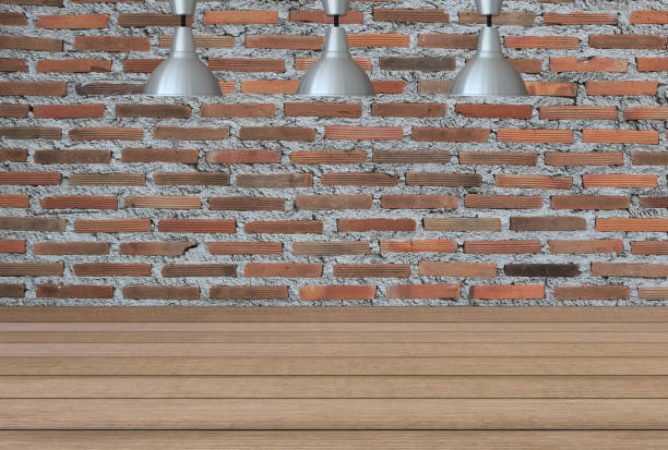 istock Silver lamps on the ceiling and a backdrop on a brick wall with brown wood floor,concepts of interior design. 805864930