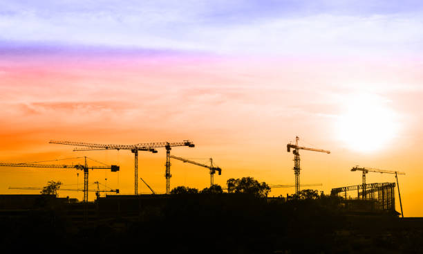 istock Highrise tower crane lifting the cargo on colorful sky. 806040496