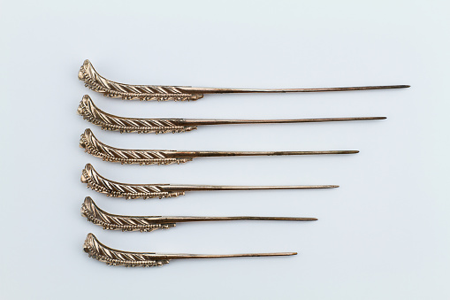 Old Thai rusty grunge ancient copper alloy  hairpin on white background