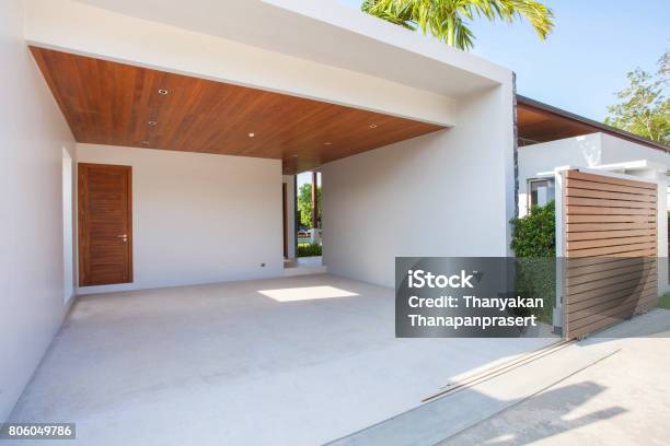 Interior And Exterior Design Of White Carport With Wooden Ceiling And Wooden Gated Area Stock Photo - Download Image Now